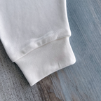 Pantalón tiro bajo bebé blanco — detalle algodón orgánico | Ecobebé